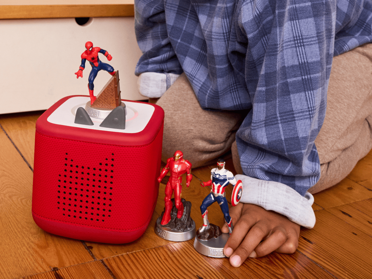 child playing with MARVEL Tonies and a Toniebox 2