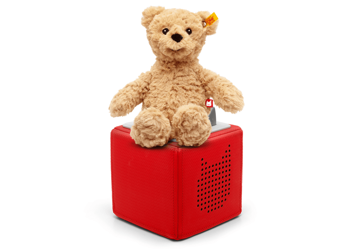 Full view of a Steiff Jimmy Bear Plush Tonie on a red Toniebox