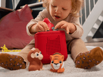 Child playing with Jungle my first tonies set audio figurines and Toniebox 2