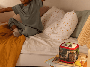 Child Playing Near A Jurassic Park Sleeve On A Red Toniebox 2