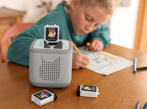 Lifestyle image of child listening to Minecraft Audiobook Tonie on Gray Toniebox 2