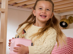 Child Playing With Pink Toniebox 2, An Audio Player For Kids With Moana Audio Figurine