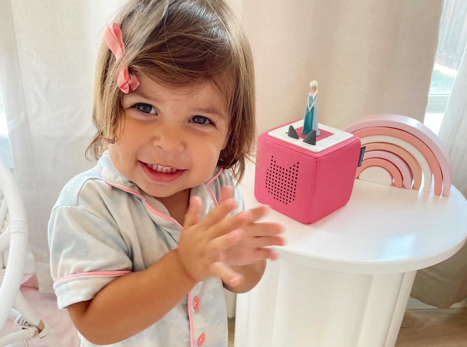 Young child with pink Toniebox and Frozen Tonie
