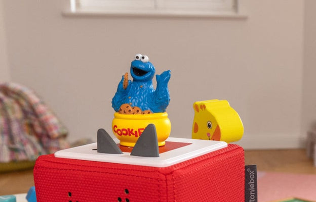 Cookie Monster and Elmo Tonies with a red Toniebox ready for audio fun