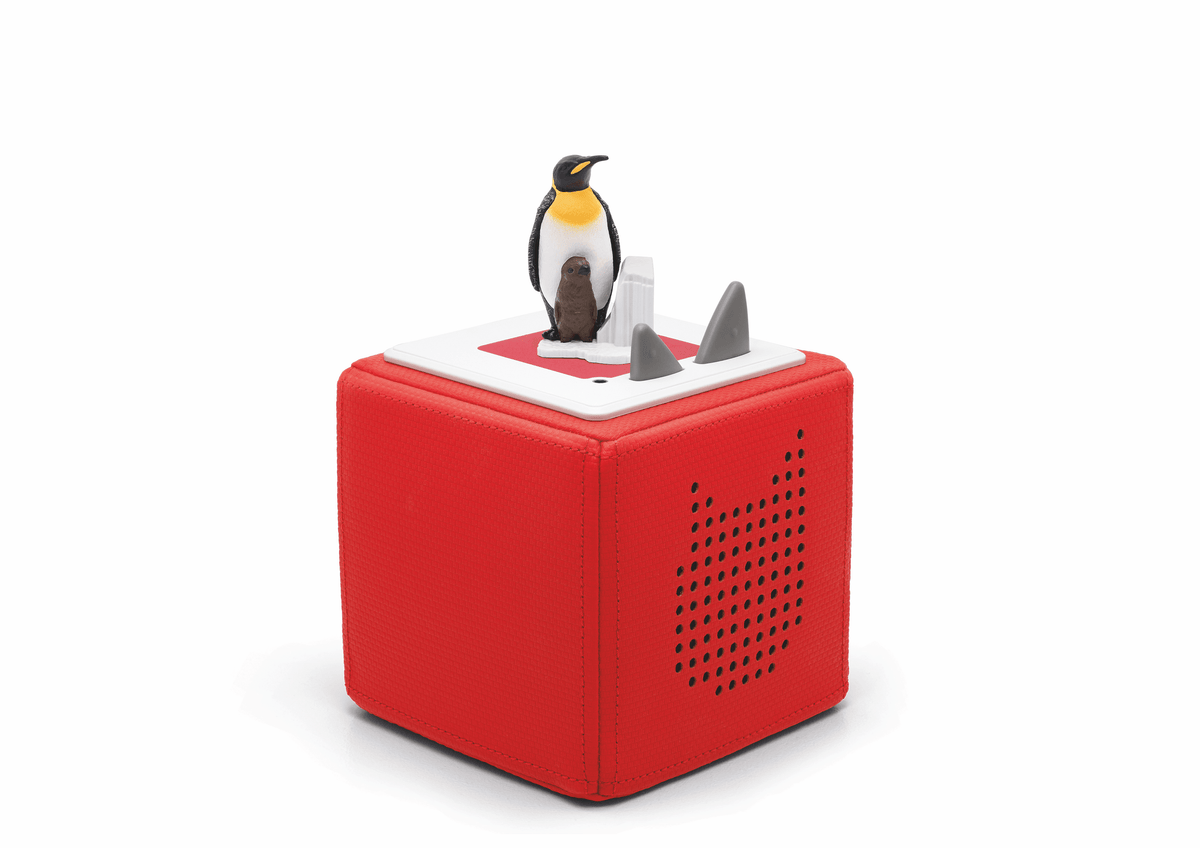 Full view of a National Geographic Kids: Penguin Tonie on a red Toniebox