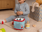 Child playing with Peppa Pig Sleeve on a red Toniebox 2
