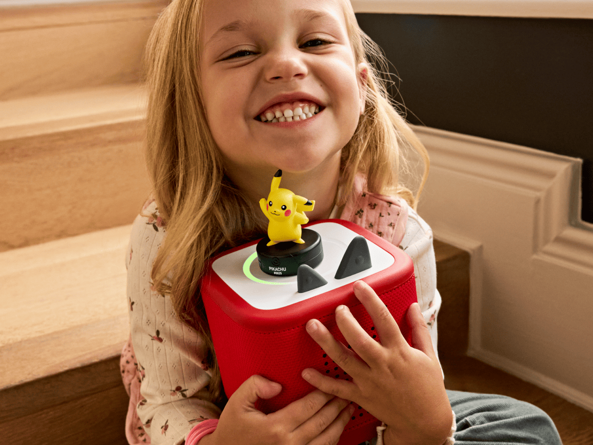 child holding the Pokémon Pikachu Tonie and a toniebox 2