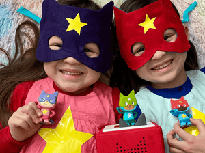 Child Playing With Pink & Purple Superhero Creative-Tonie