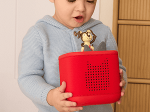 Child Playing With Sunset Red Toniebox 2 Starter Set With Playtime Puppy Tonie