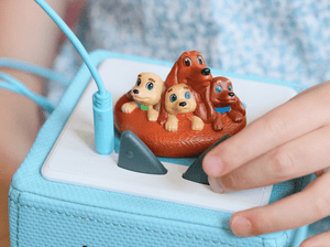 Child Playing With Pretzel And The Puppies Tonie