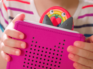 Child Playing With Favorite Tales: Pride Tonie