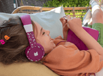 Child Using The Toniesâ® Purple Wired Headphones For Kids