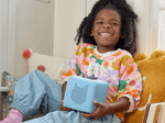 Child Playing With Questioneers Audio Figurine And Toniebox 2