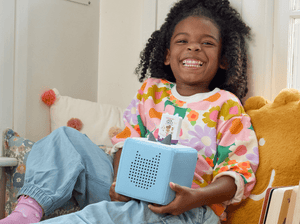 Child Playing With Questioneers Audio Figurine And Toniebox 2