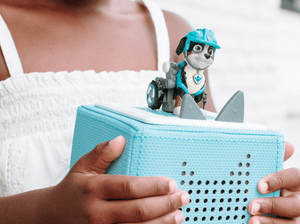 Child Playing With [Rex Tonie Audio Figurine And Toniebox 2