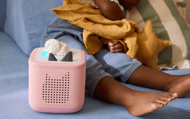 child enjoying nap time with the sleepy sheep and pink Toniebox 2