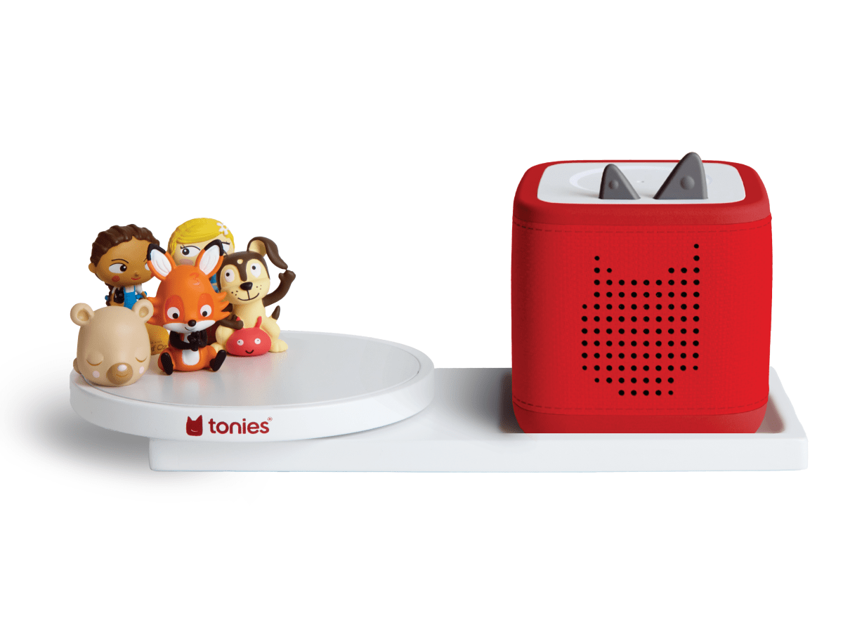 Red Toniebox 2 on rotating shelf with various Tonies