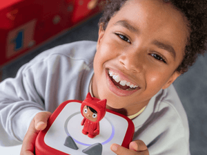 Child Enjoying A Tonie And Toniebox 2, An Audio Player For Kids