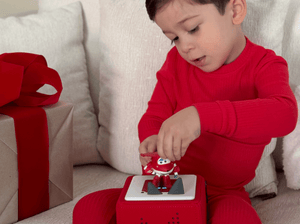 Child Playing With Super Wings: A World Of Adventure Tonie