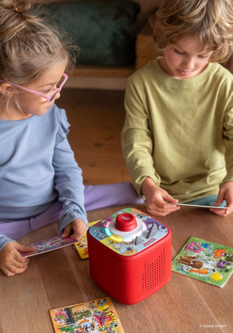 Children playing a Tonieplay game on a red Toniebox 2