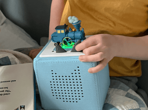 Child Playing With The Little Engine That Could Tonie