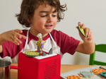 Child Playing With Tiny Chef Tonie