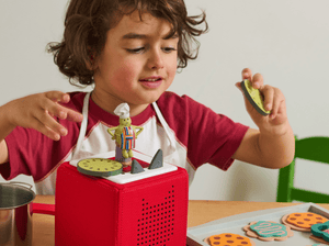 Child Playing With Tiny Chef Tonie