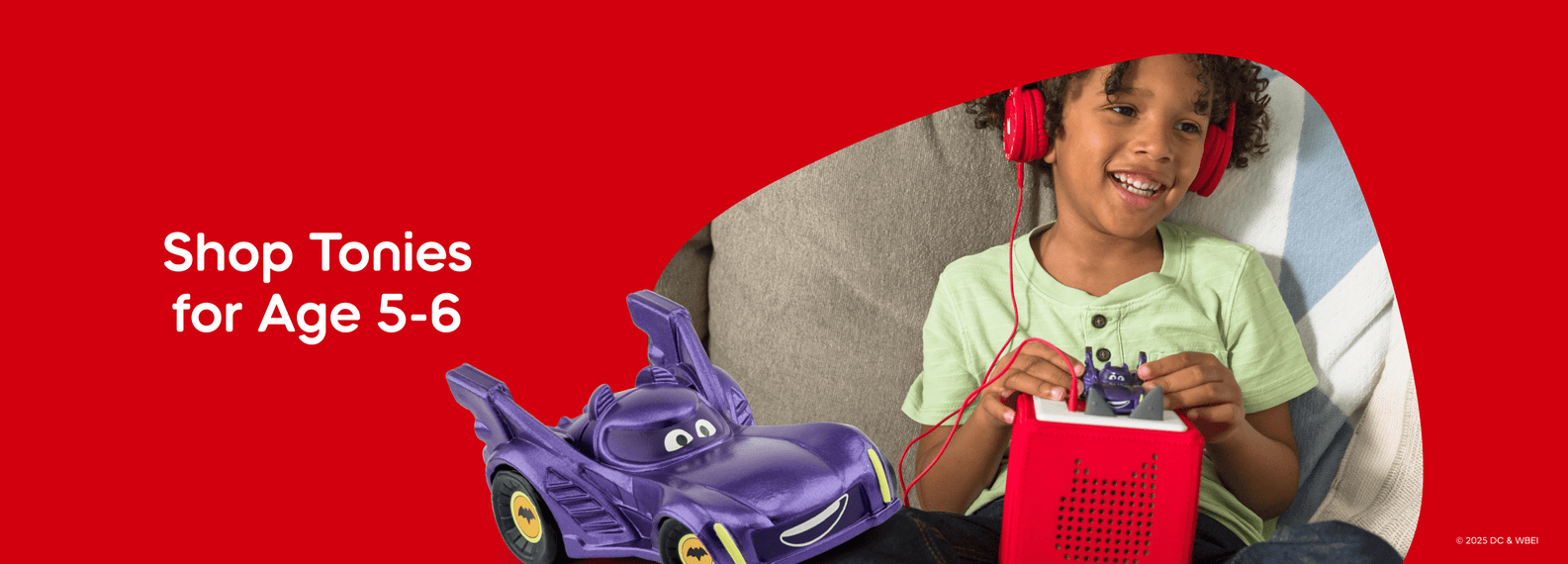 Shop Tonies for Age 5-6 text with a child listening to Batmobile Tonie and Toniebox