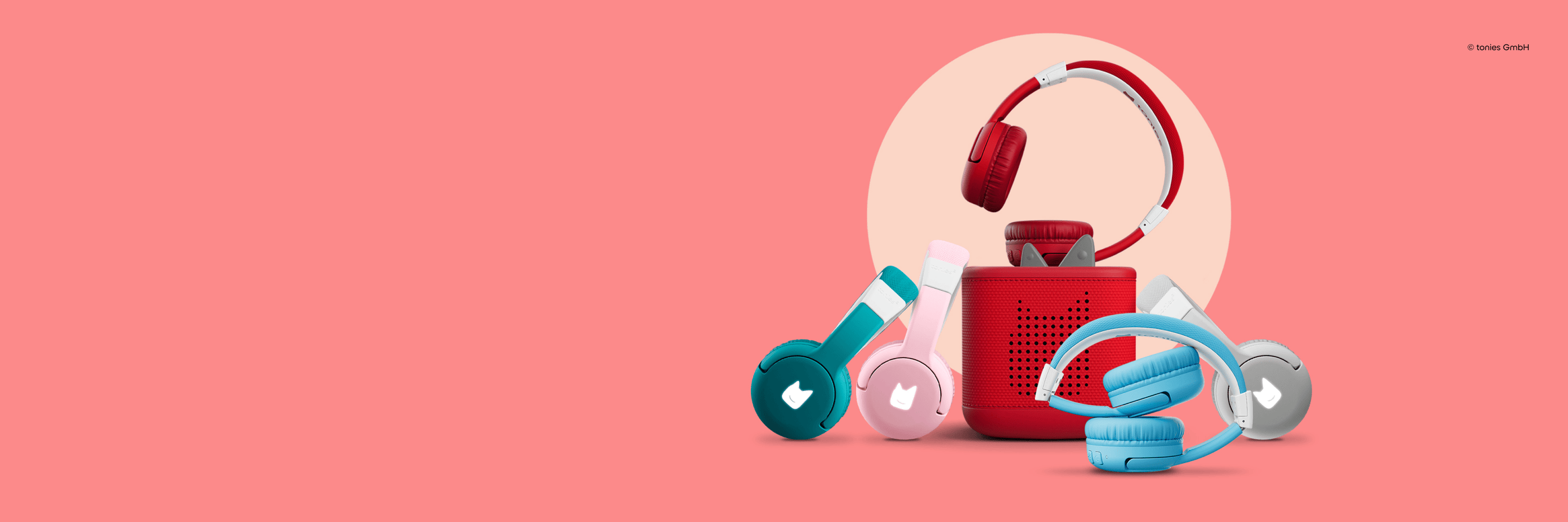 pink, teal, grey, red, and blue tonies bluetooth headphones with a red Toniebox 2.