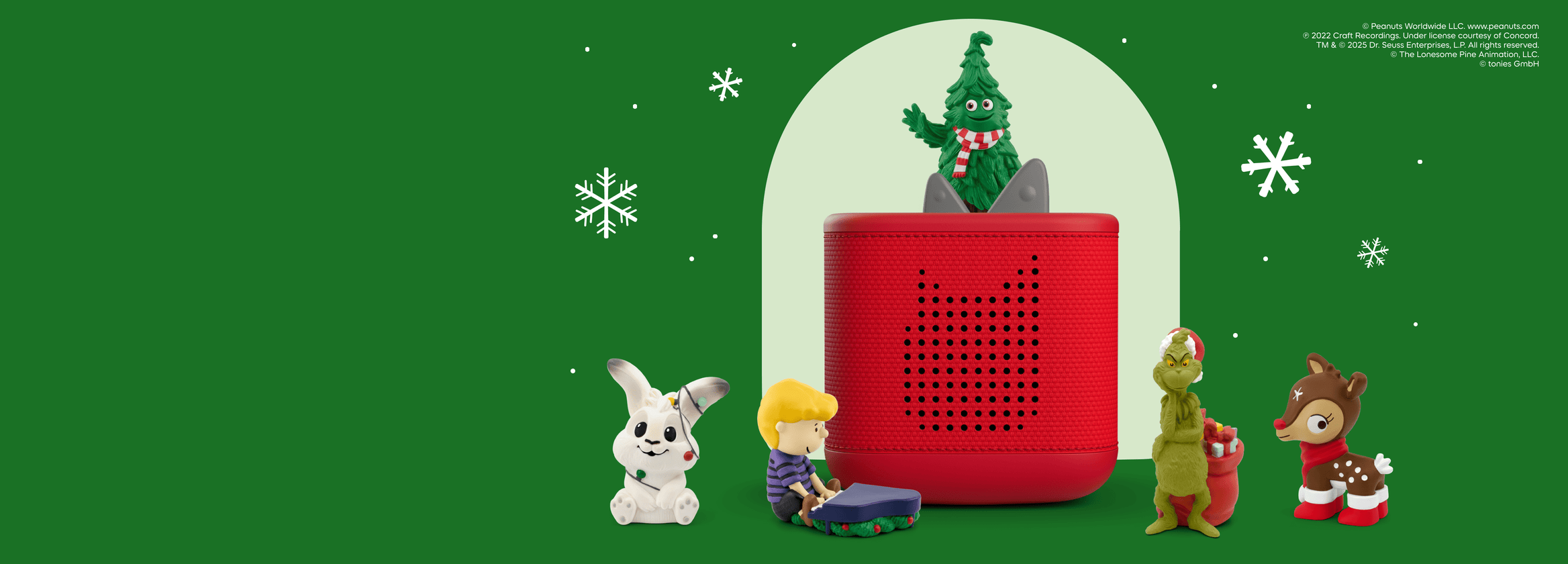 holiday tonies on a red toniebox 2 with snowflake background