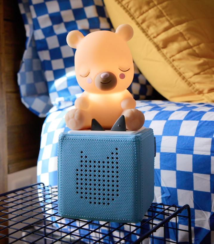 sleepy bear night light on a blue toniebox ready for nap time.