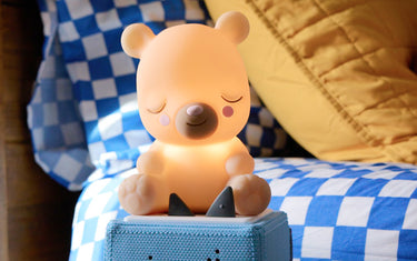 sleepy bear night light on a blue toniebox ready for nap time.