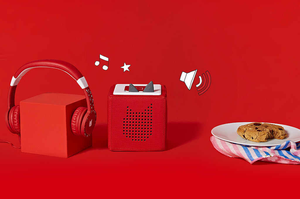 A Red Toniebox with Red headphones