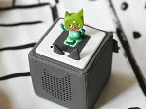 Child Playing With Turquoise & Green Superhero Creative-Tonie