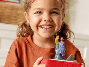 Child Playing With Disney Wish Tonie