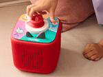 child playing with Lalalinos: Your Day in Bumbaloo - ToniePlay Game and tonieplay controller