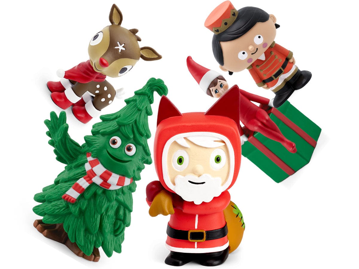 Set of Christmas-themed figurines including a Santa Claus, reindeer, and tree on a white background