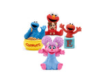 Set of Sesame Street figurines including Cookie Monster, Elmo, and Abby Cadabby on a white background.
