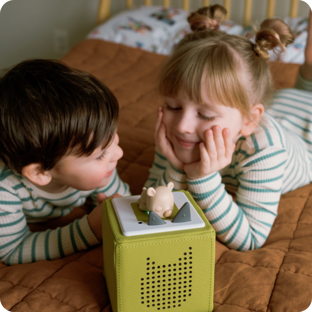 children playing with sleepy bear tonie and a green toniebox