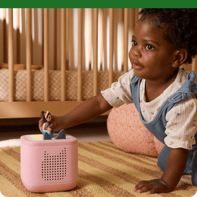 Little girl listening to the Ms Rachel Tonie on a cloud pink Toniebox 2