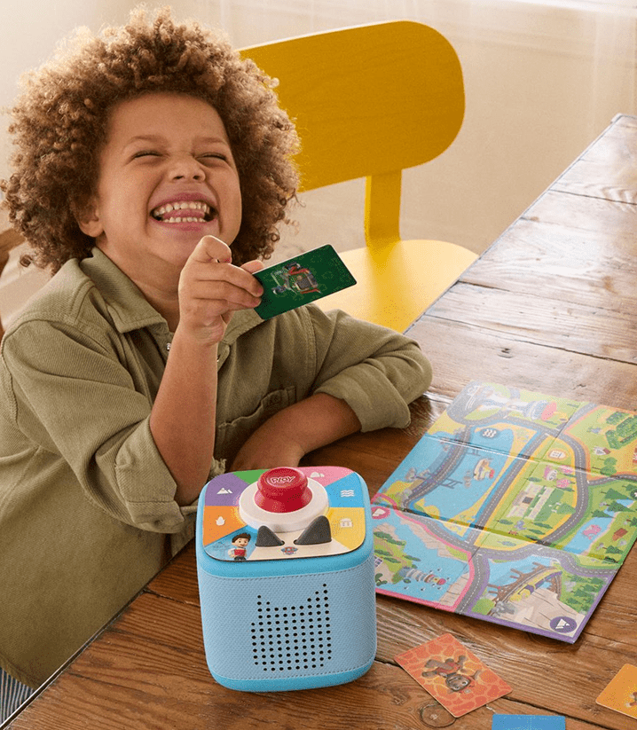 child playing PAW Patrol Tonieplay game with blue Toniebox 2