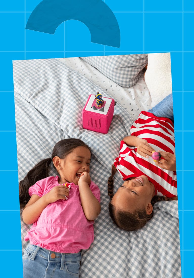 two children listening to a Toniebox and Tonie