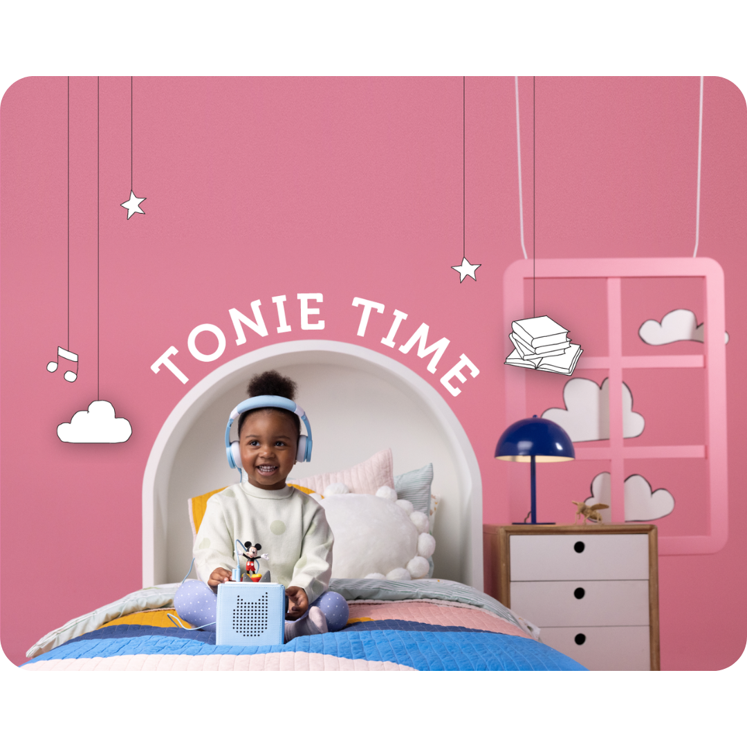 girl playing with mickey mouse tonie and a toniebox with headphones in her room